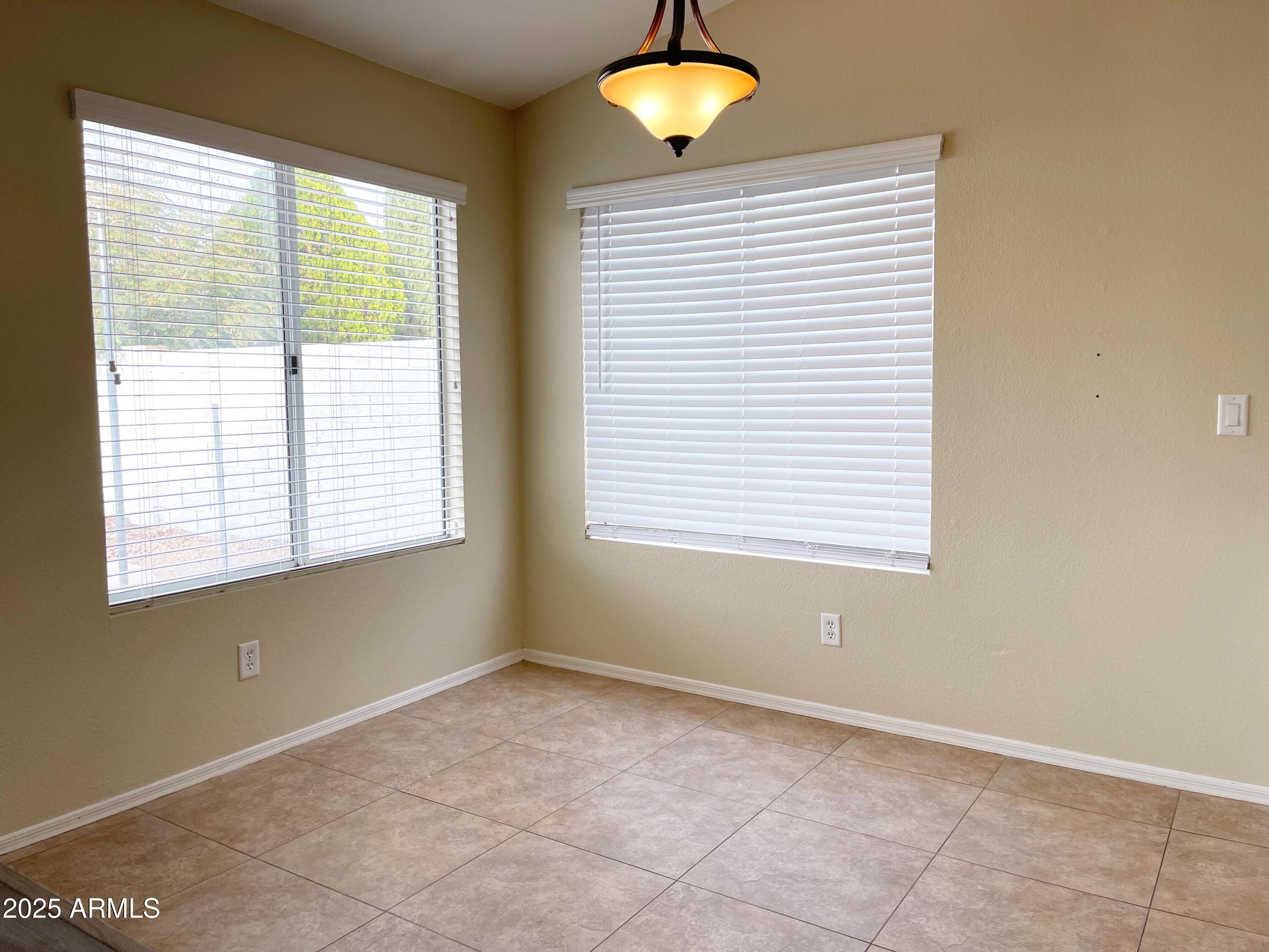 6926 West Via Del Sol Drive Glendale, AZ 85310 - Photo 7 of 18 a view of an empty room with a window