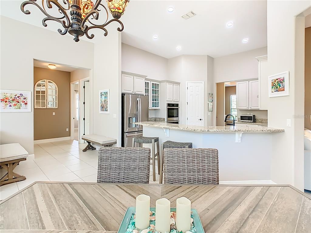 915 San Raphael Street Poinciana, FL 34759 - Photo 17 of 84 a spacious bedroom with a bed and ceiling fan