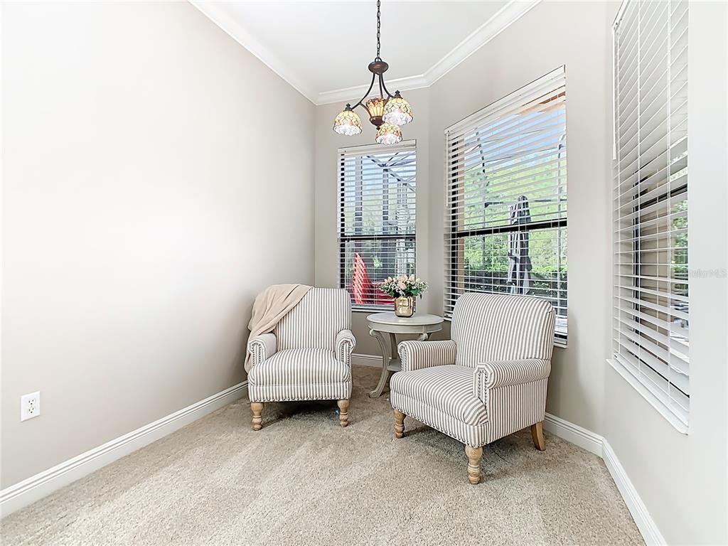 915 San Raphael Street Poinciana, FL 34759 - Photo 23 of 84 a living room with furniture and a large window
