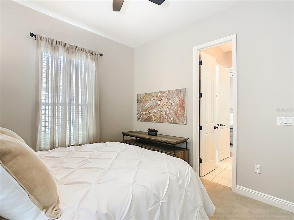 915 San Raphael Street Poinciana, FL 34759 - Photo 35 of 84 a bedroom with a bed and a window