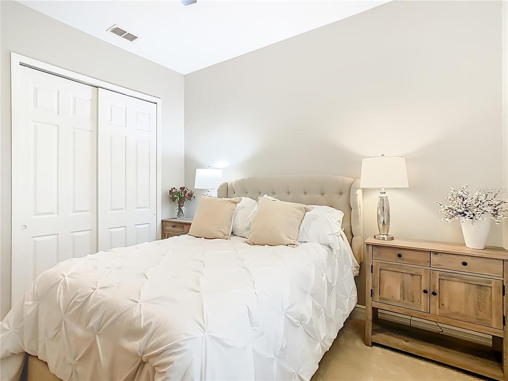 915 San Raphael Street Poinciana, FL 34759 - Photo 37 of 84 a large white bed in a white room