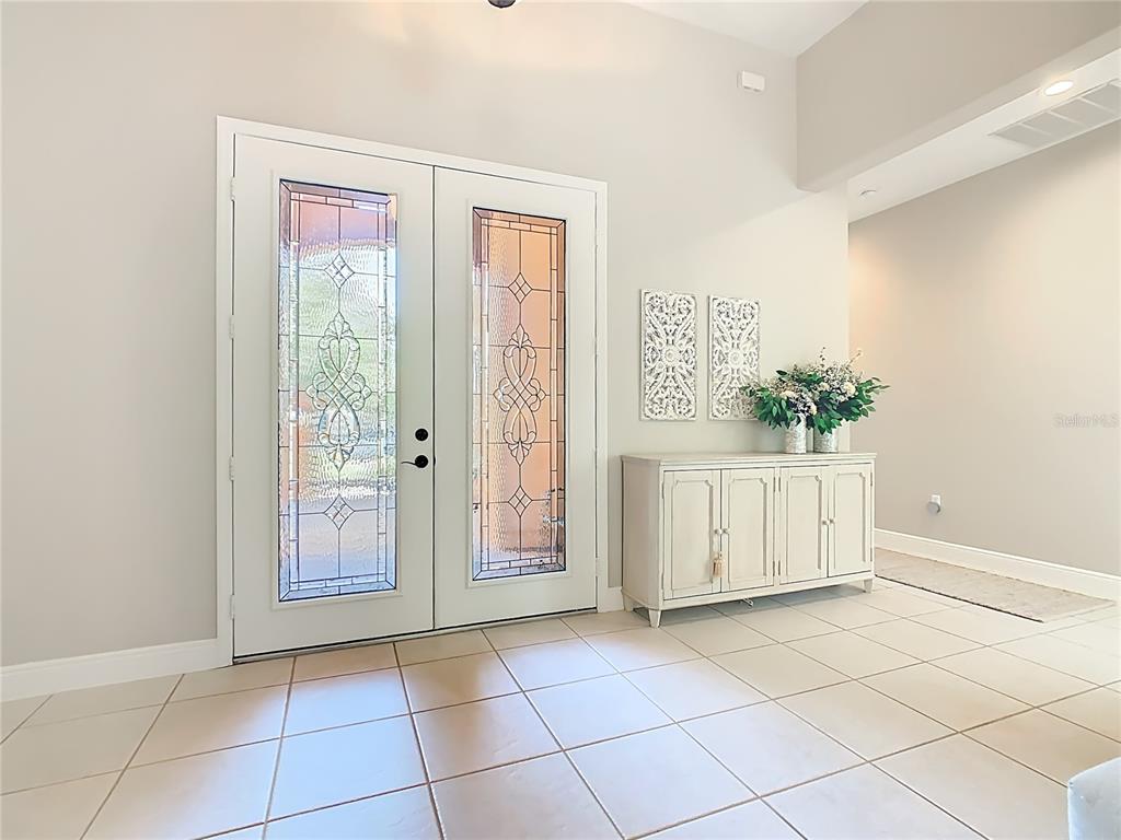 915 San Raphael Street Poinciana, FL 34759 - Photo 4 of 84 a view of a hallway with entryway door