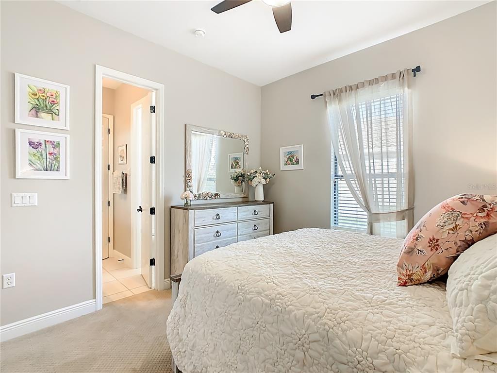 915 San Raphael Street Poinciana, FL 34759 - Photo 43 of 84 a bedroom with a bed and a window