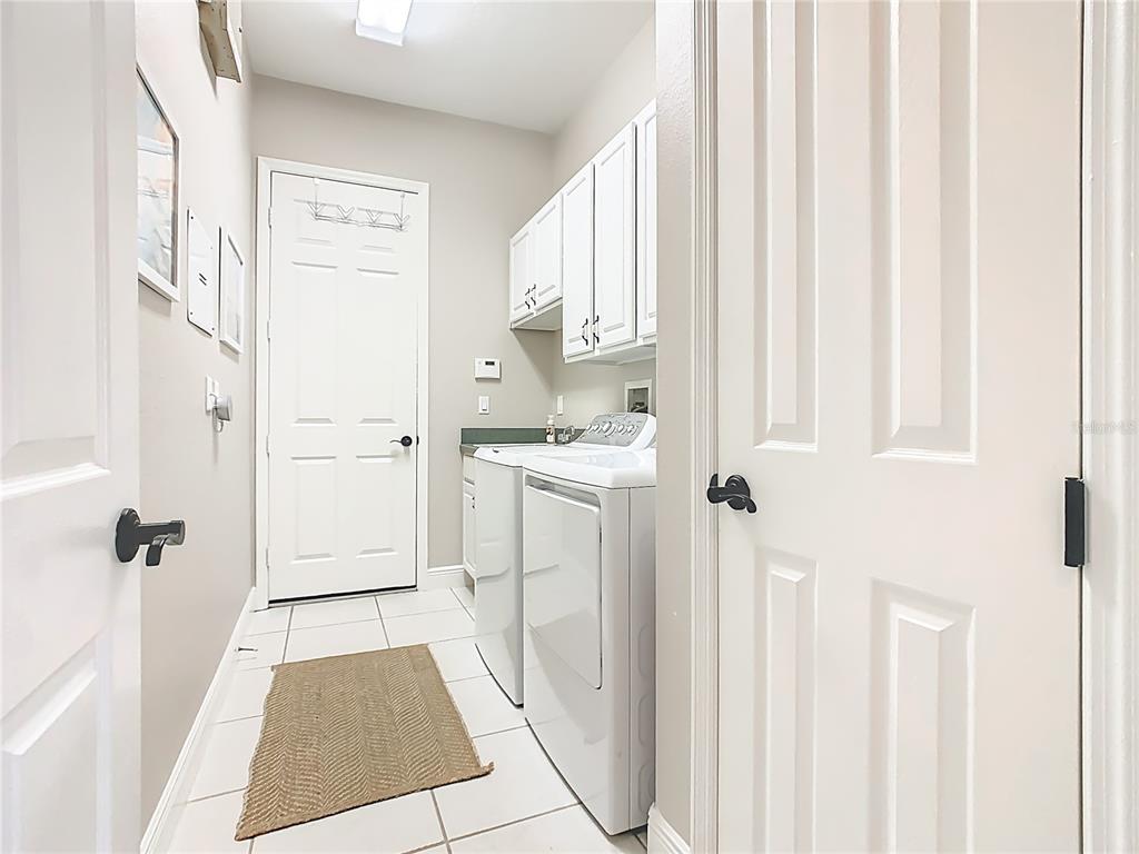 915 San Raphael Street Poinciana, FL 34759 - Photo 47 of 84 a bathroom with a sink a toilet and a shower