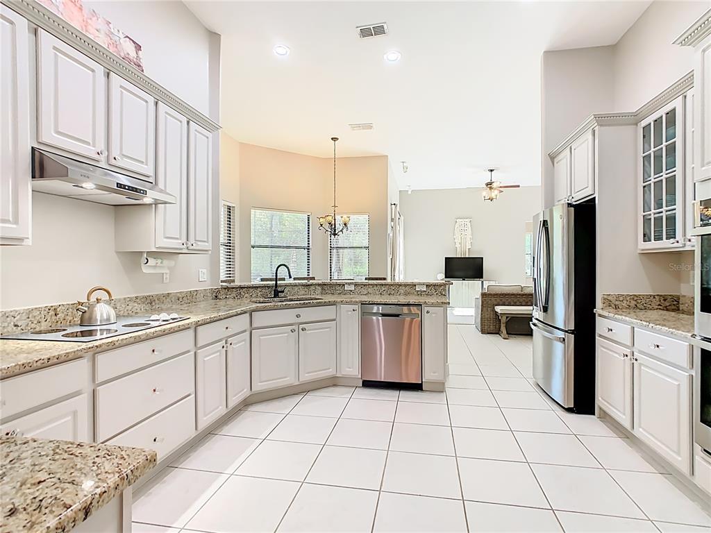 915 San Raphael Street Poinciana, FL 34759 - Photo 10 of 84 a kitchen with a sink and cabinets