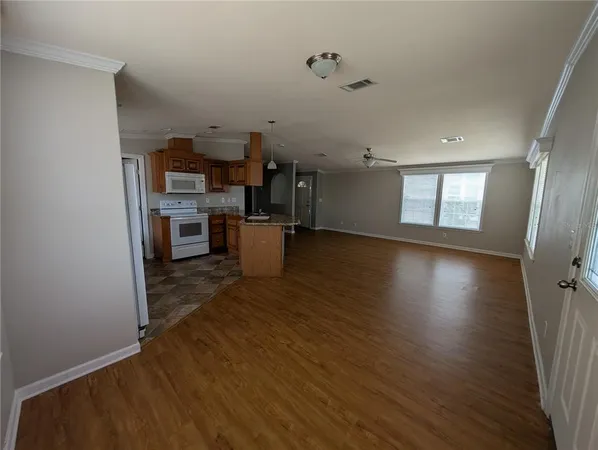 a view of a storage & utility room with wooden floor