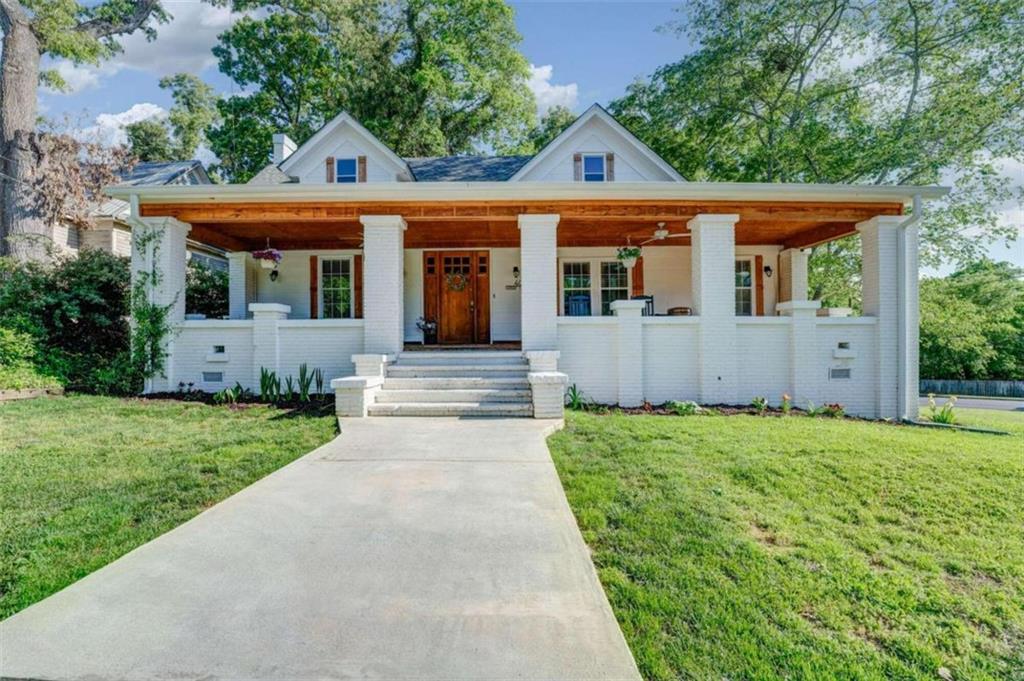 front view of a house with a yard
