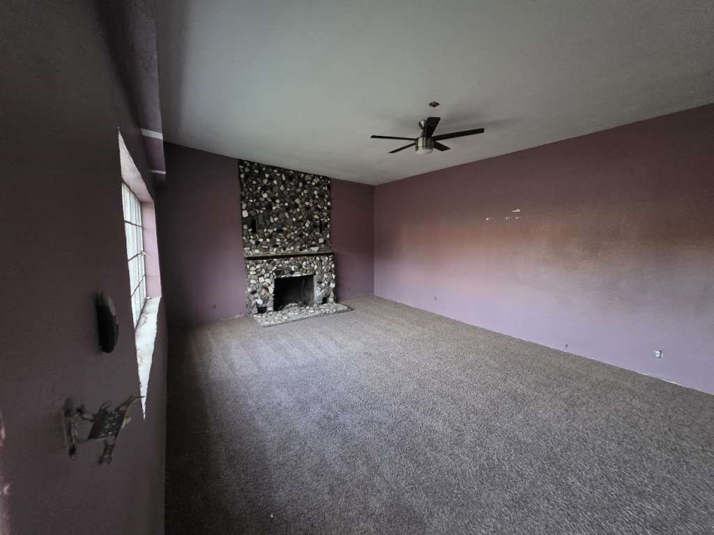7833 Kiely Road Vinton, TX 79821 - Photo 2 of 10 an empty room with windows and ceiling fan