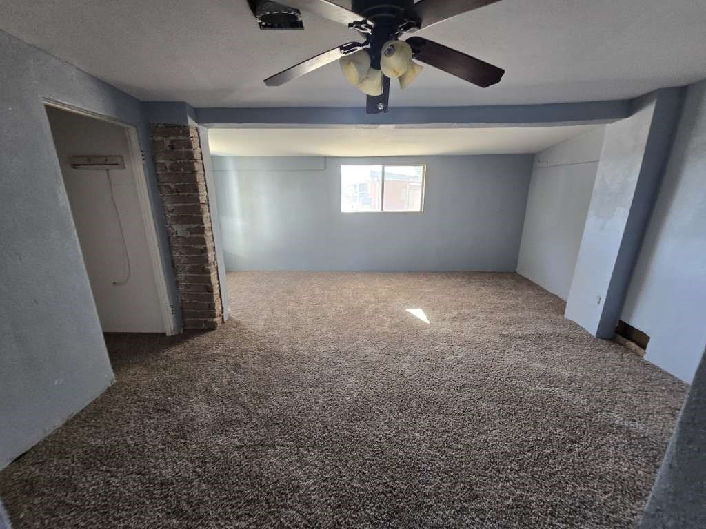 7833 Kiely Road Vinton, TX 79821 - Photo 5 of 10 en empty room with windows and ceiling fan