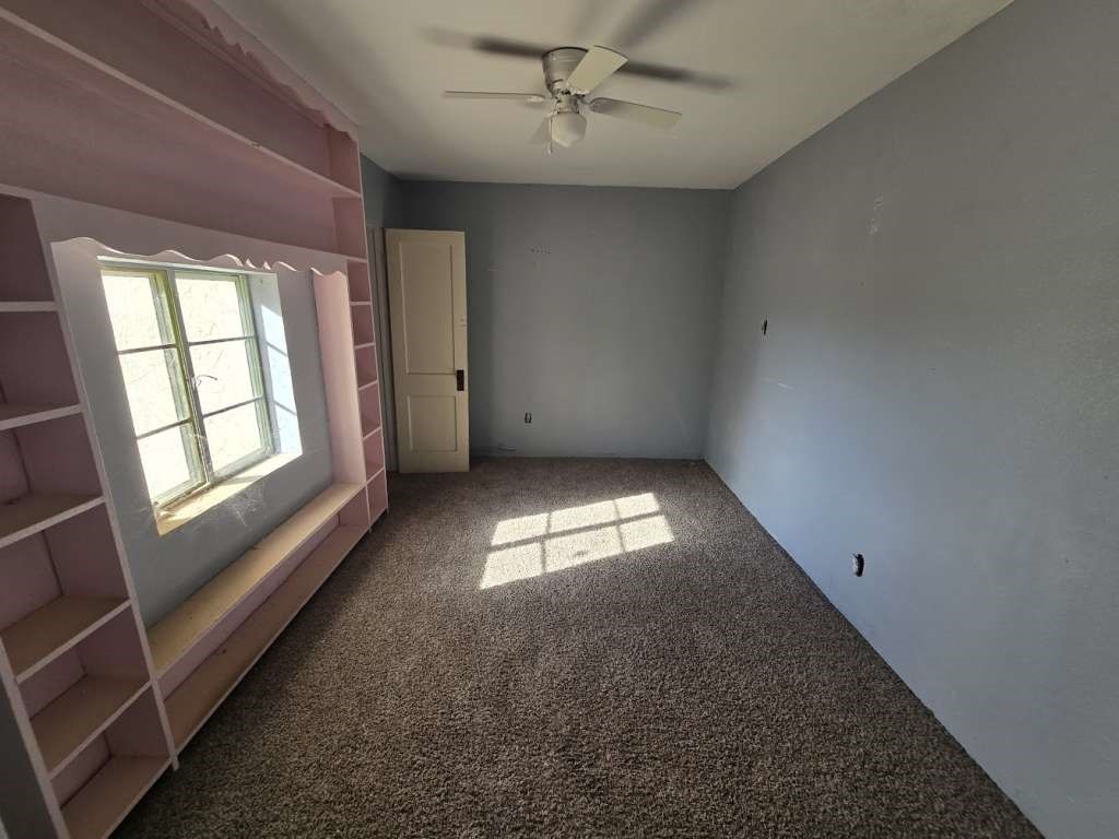 7833 Kiely Road Vinton, TX 79821 - Photo 6 of 10 an empty room with a empty space and windows