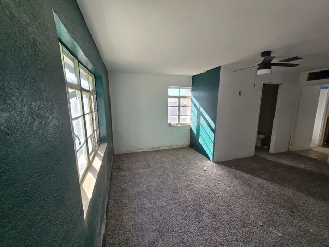 an empty room with windows