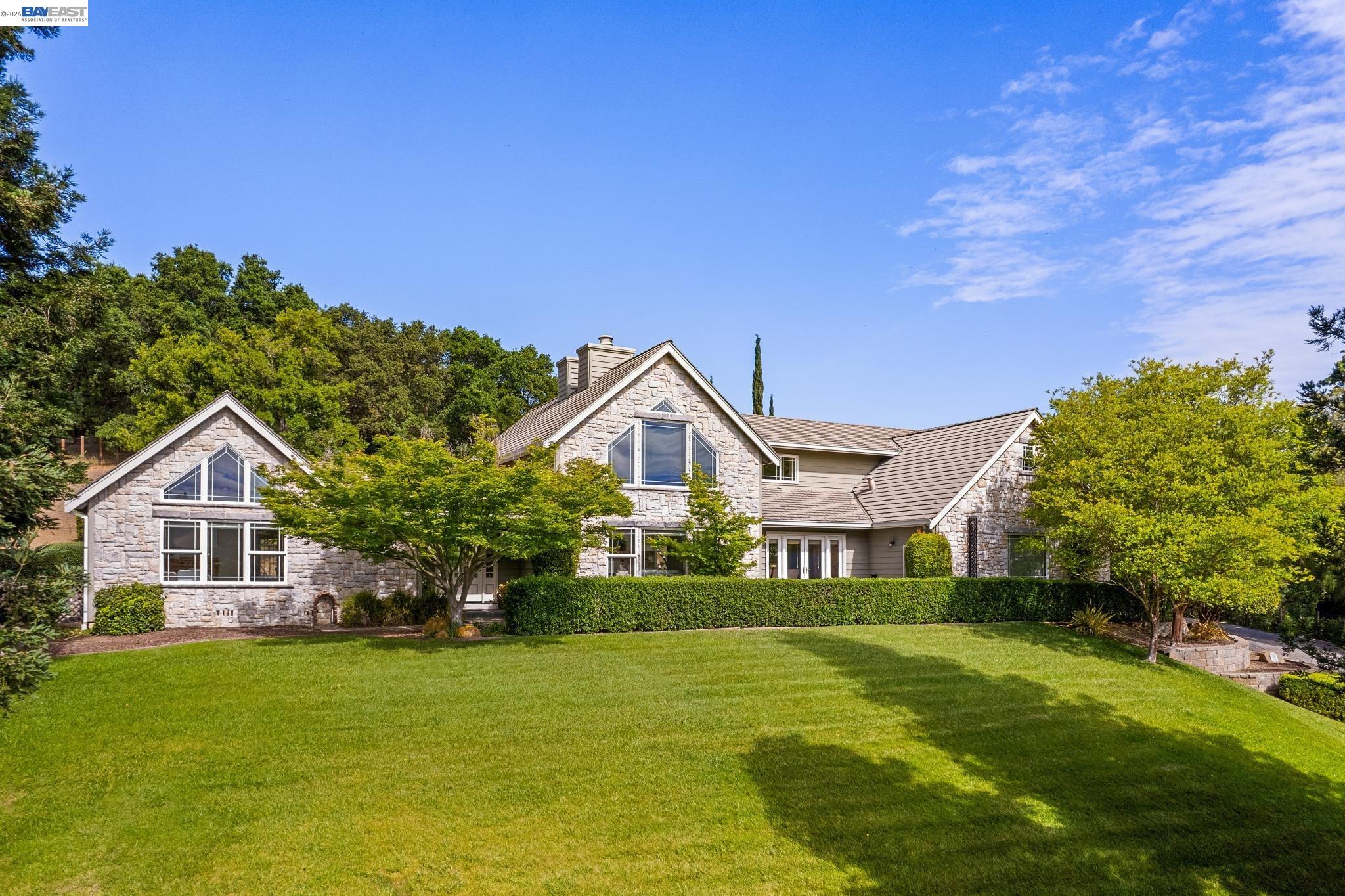 409 Oak Lane Pleasanton, CA 94566 - Photo 1 of 1 a front view of a house with a garden