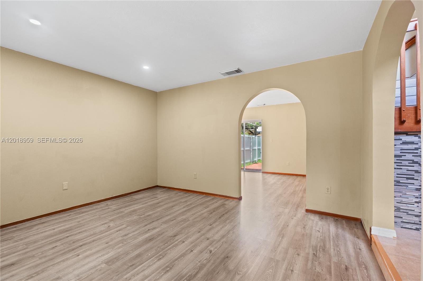 15345 Southwest 63rd Terrace Miami, FL 33193 - Photo 40 of 51 a view of empty room with wooden floor and fan