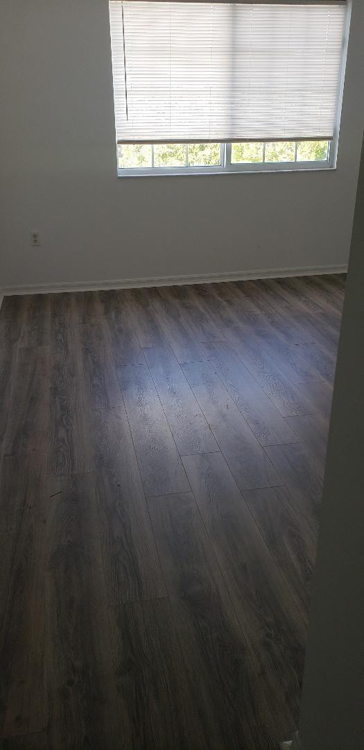 5011 Wiles Road, Unit 301 Coconut Creek, FL 33073 - Photo 15 of 16 a view of wooden floor and windows