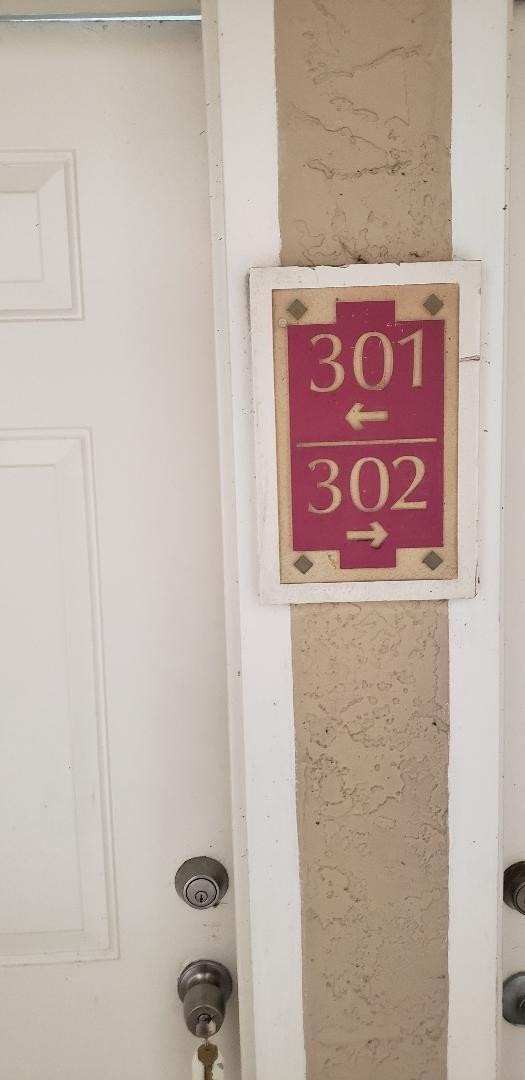 5011 Wiles Road, Unit 301 Coconut Creek, FL 33073 - Photo 5 of 16 a sign on the wall