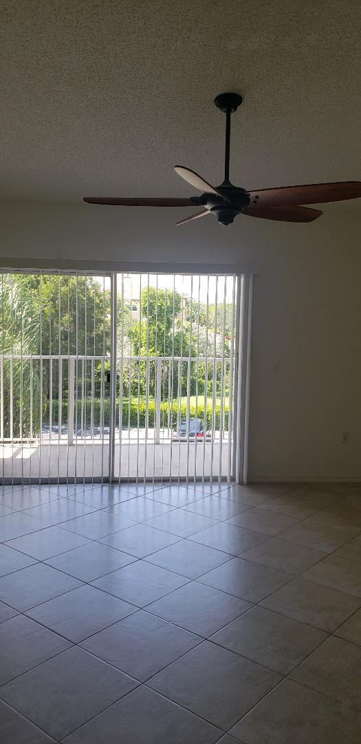 5011 Wiles Road, Unit 301 Coconut Creek, FL 33073 - Photo 7 of 16 a view of an empty room with a window