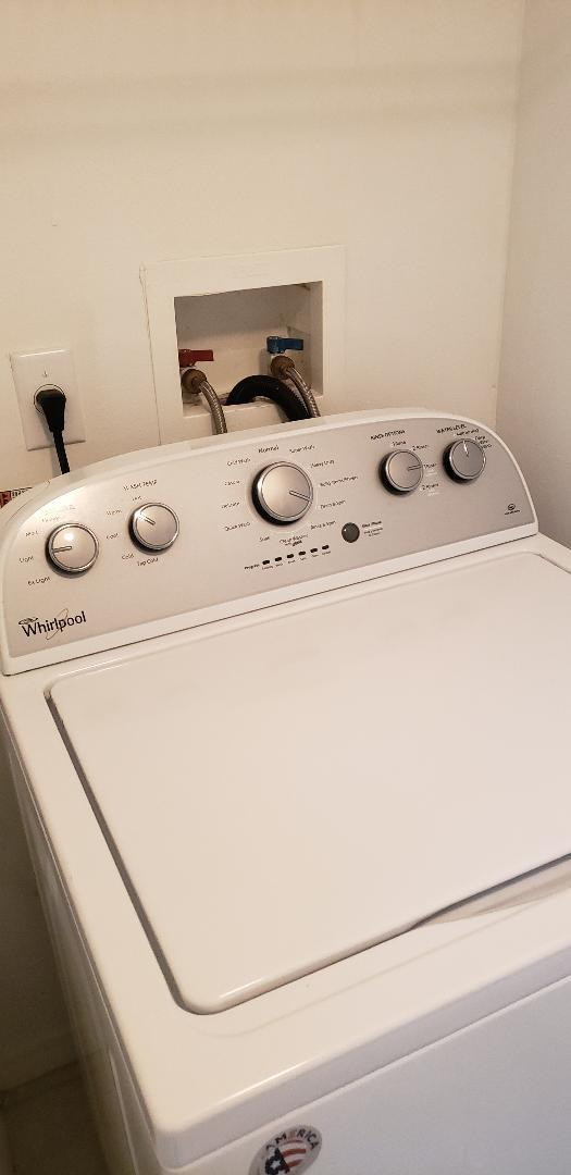 5011 Wiles Road, Unit 301 Coconut Creek, FL 33073 - Photo 9 of 16 a utility room with dryer and washer