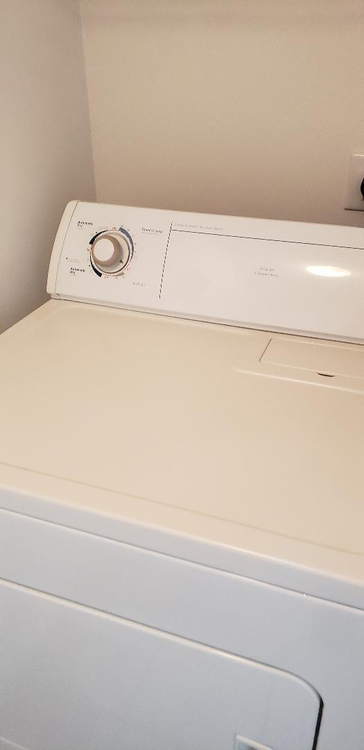 5011 Wiles Road, Unit 301 Coconut Creek, FL 33073 - Photo 10 of 16 a close up view of a washer and dryer