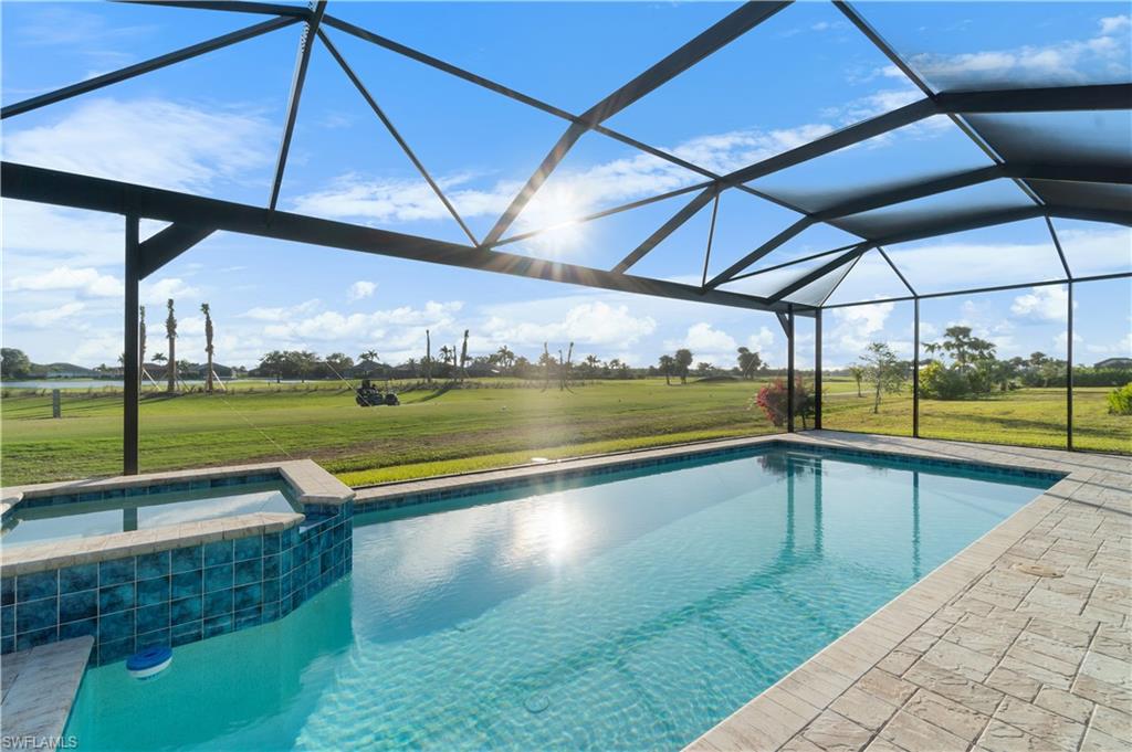 18684 Ensenada Drive Naples, FL 34114 - Photo 1 of 34 a view of swimming pool from a balcony
