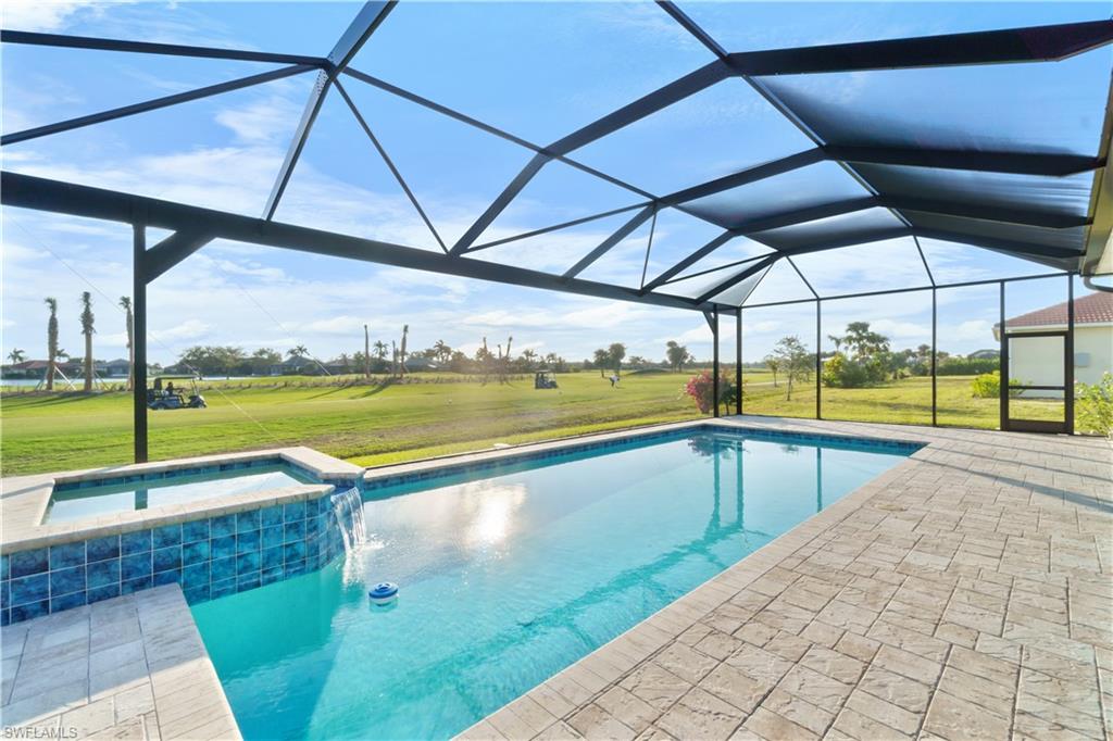 18684 Ensenada Drive Naples, FL 34114 - Photo 28 of 34 a view of a swimming pool with a porch