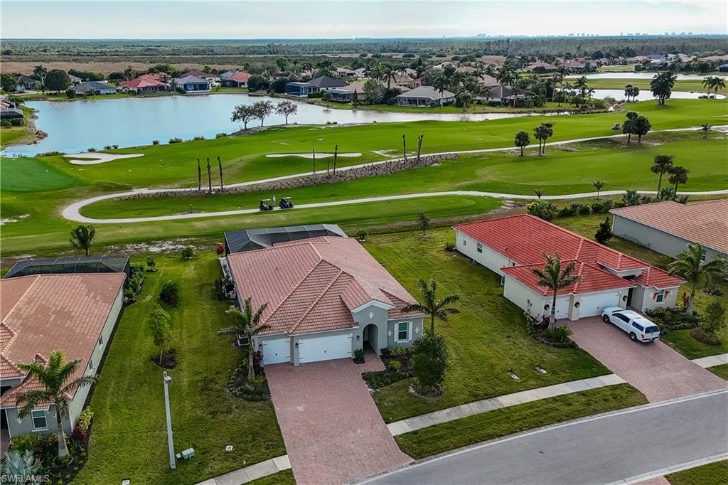 18684 Ensenada Drive Naples, FL 34114 - Photo 34 of 34 an aerial view of a golf course with a lake view