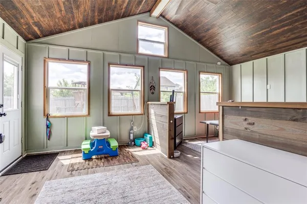 a living room with furniture a window and a chandelier