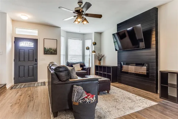 a living room with furniture and a fireplace