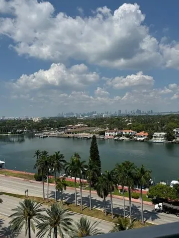 a view of a living room with kitchen