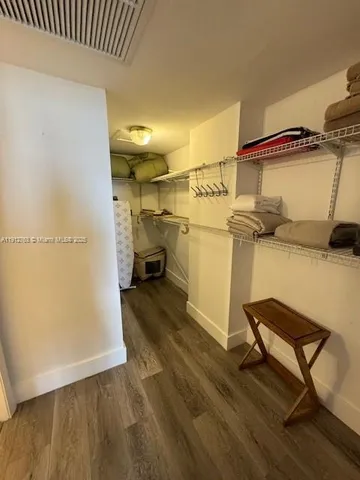 a bathroom with a double vanity sink and mirror