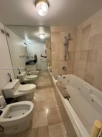 a bedroom with double bed and a window