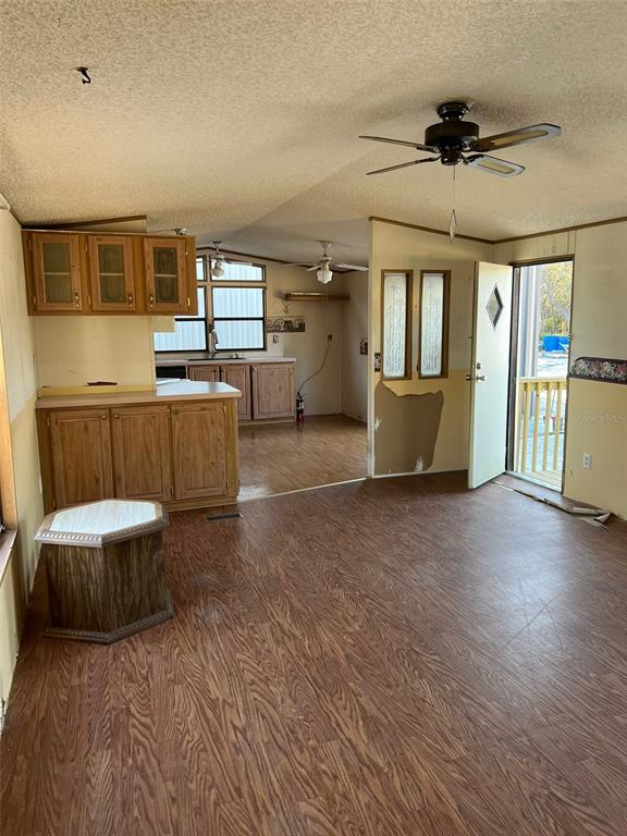 8342 Southwest 152nd Place Dunnellon, FL 34432 - Photo 38 of 96 a living room with a couch and a ceiling fan