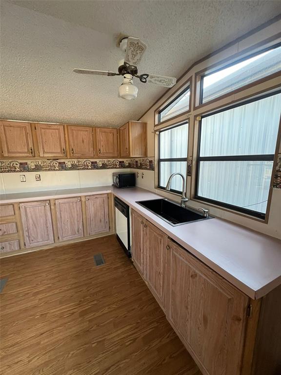8342 Southwest 152nd Place Dunnellon, FL 34432 - Photo 40 of 96 a kitchen with stainless steel appliances sink cabinets and window