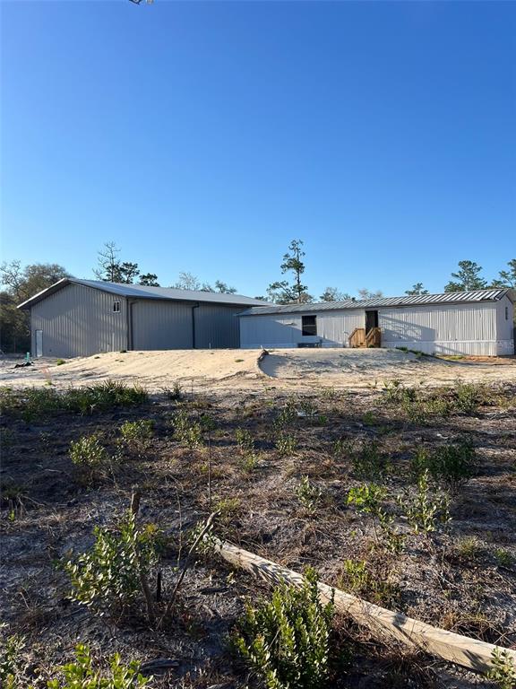 8342 Southwest 152nd Place Dunnellon, FL 34432 - Photo 82 of 96 a view of a lake with beach and large trees