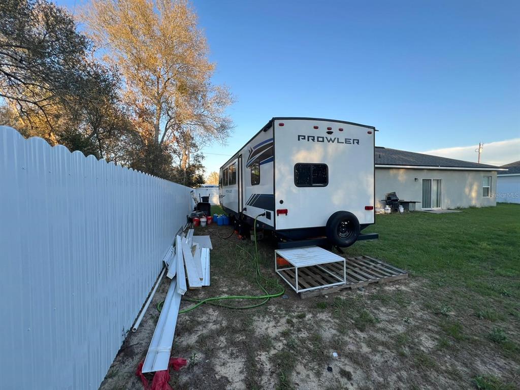 8342 Southwest 152nd Place Dunnellon, FL 34432 - Photo 87 of 96 a front view of a house with garden and chairs