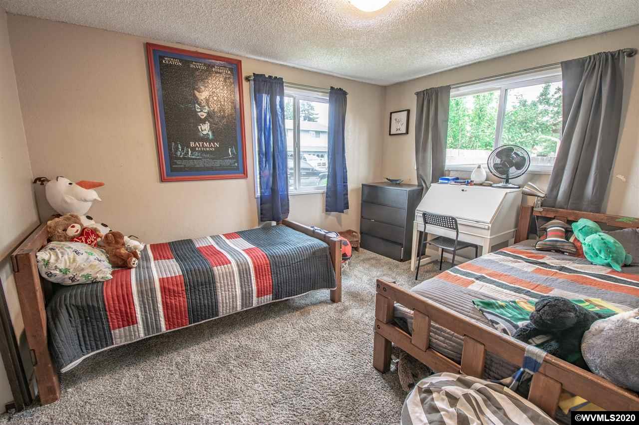 1955 Debra Drive Springfield, OR 97477 - Photo 17 of 27 a bedroom with a bed and wooden floor