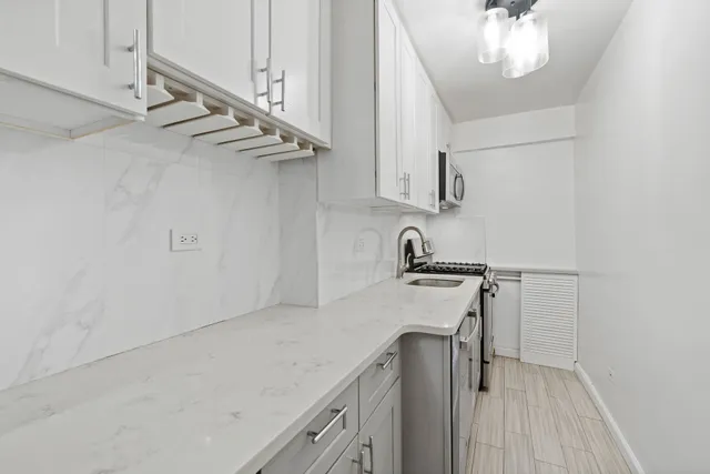 a view of a kitchen with a sink