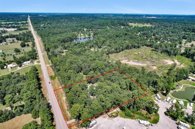 a view of a green yard with an buildings