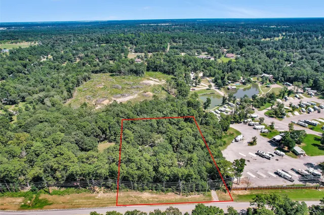 a view of a city with lush green forest