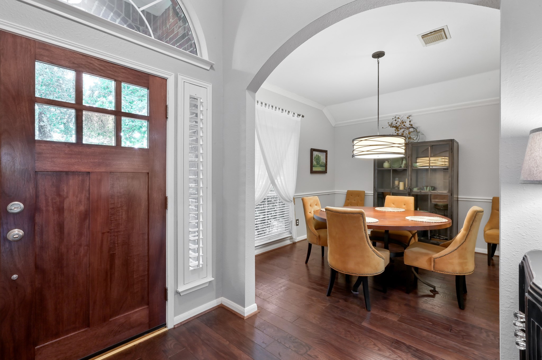 2 Westward Ridge Place The Woodlands, TX 77384 - Photo 11 of 43 An elegant archway off the entry welcomes you into the dining room