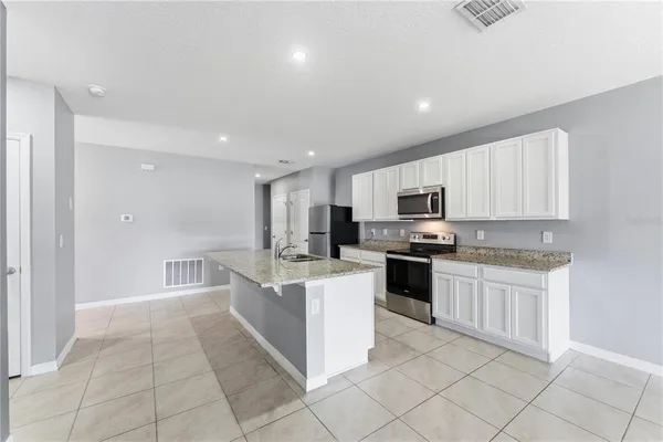 a large kitchen with cabinets