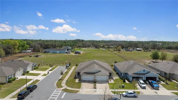 a view of a lake with couches and city view