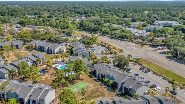an aerial view of residential houses with outdoor space