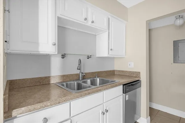 a kitchen with a sink and cabinets