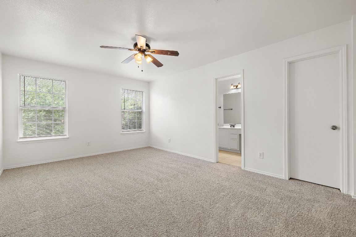 13718 Merseyside Drive Pflugerville, TX 78660 - Photo 7 of 13 a view of empty room with windows
