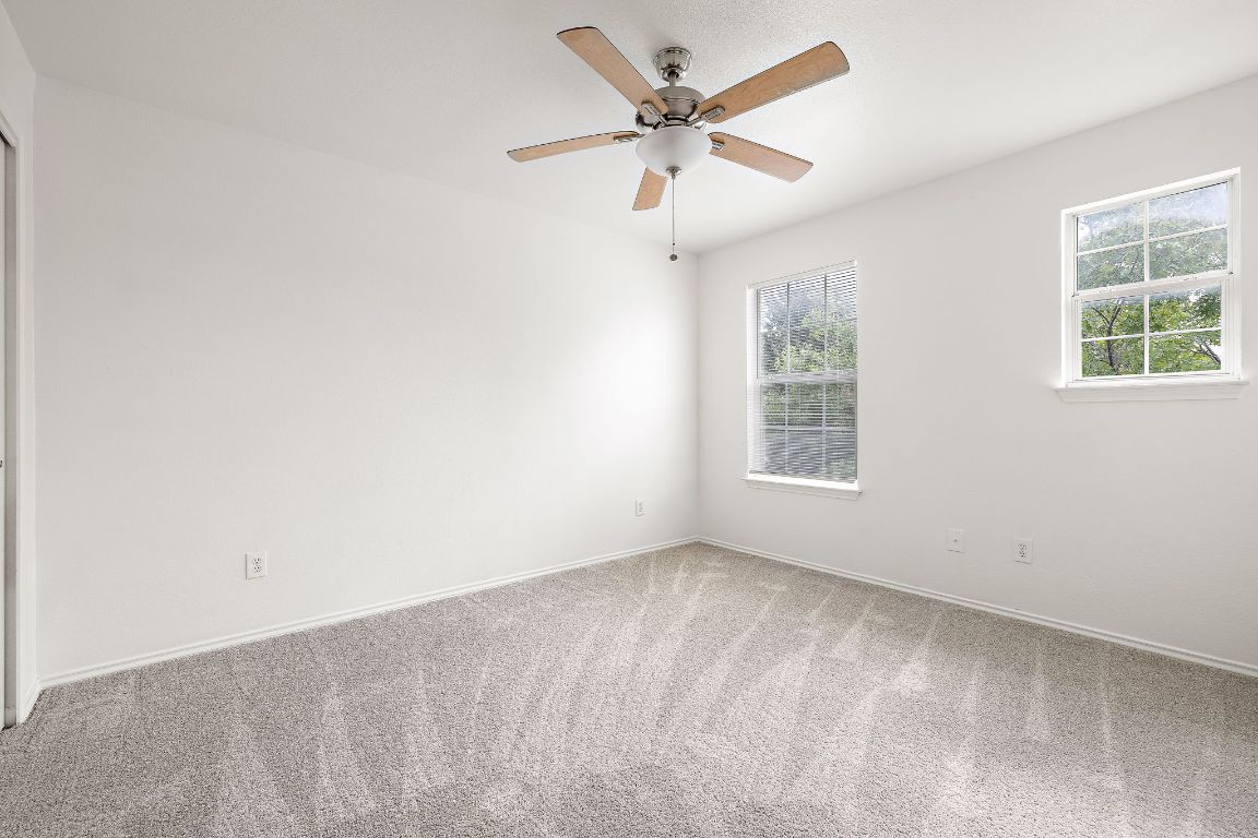 13718 Merseyside Drive Pflugerville, TX 78660 - Photo 10 of 13 an empty room with a window and a fan