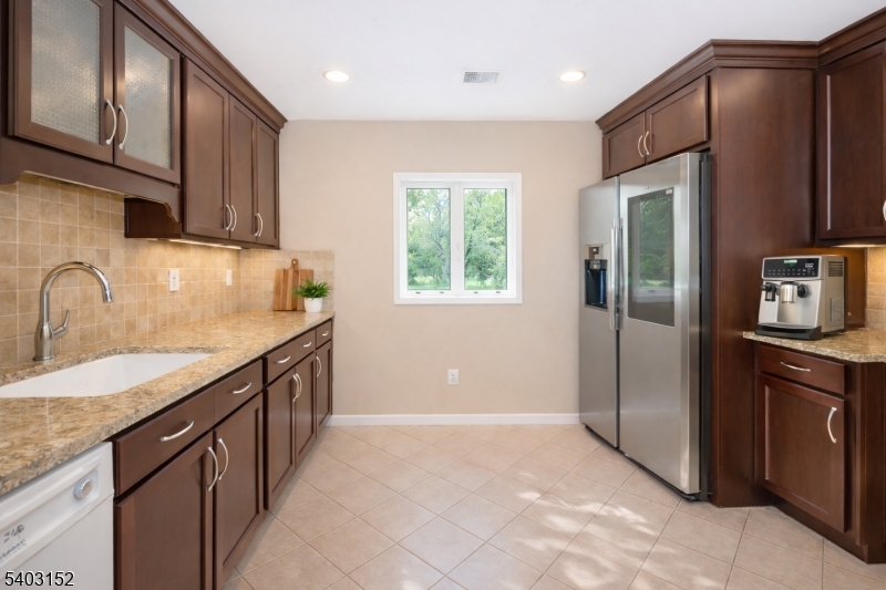 2 Robert Street Flanders, NJ 07836 - Photo 14 of 38 a kitchen with stainless steel appliances granite countertop a refrigerator and a sink
