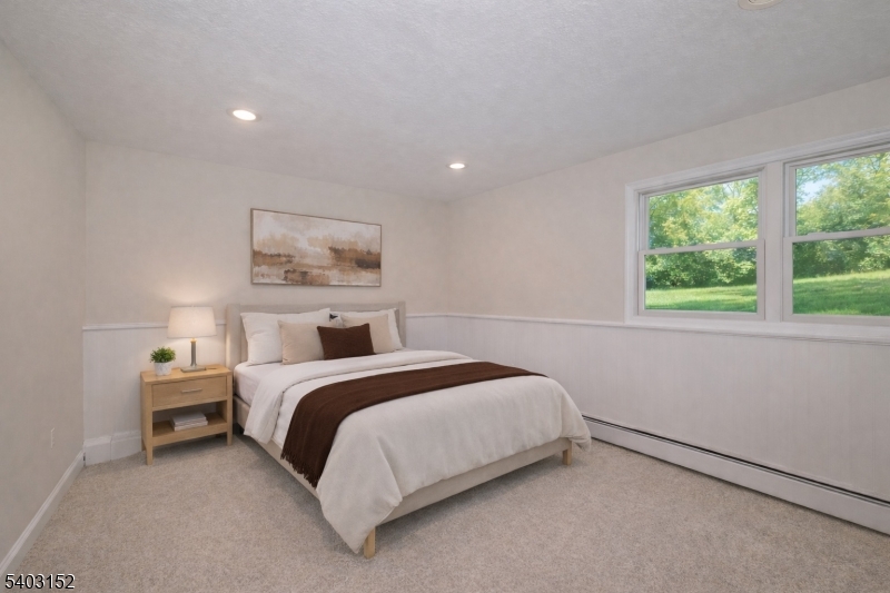 2 Robert Street Flanders, NJ 07836 - Photo 24 of 38 a bed room with a bed and a painting