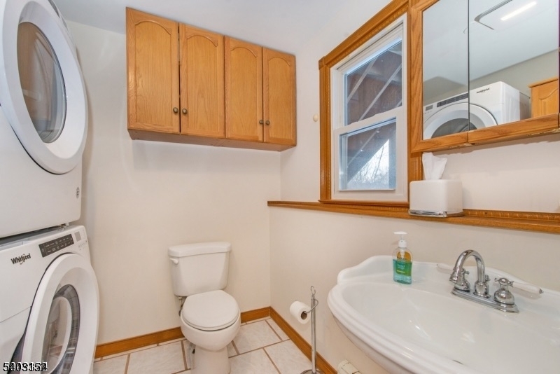 2 Robert Street Flanders, NJ 07836 - Photo 26 of 38 a bathroom with a sink a toilet and a mirror