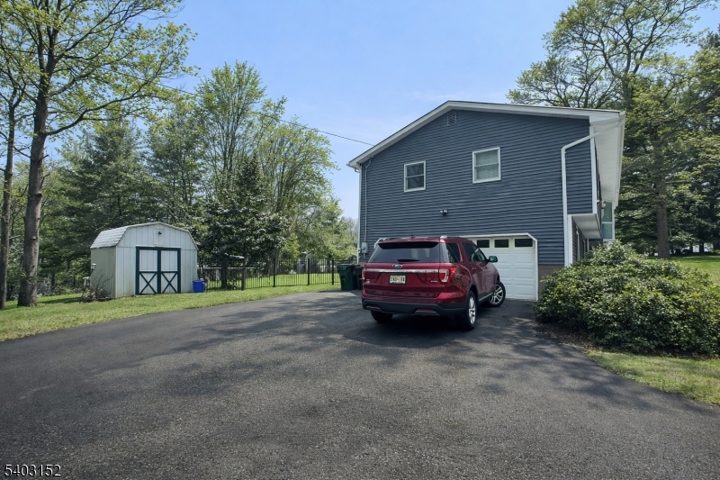 2 Robert Street Flanders, NJ 07836 - Photo 35 of 38 a car parked in front of a house with a parked car