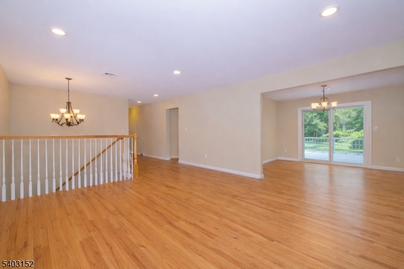 2 Robert Street Flanders, NJ 07836 - Photo 6 of 38 a view of an empty room with wooden floor and a window